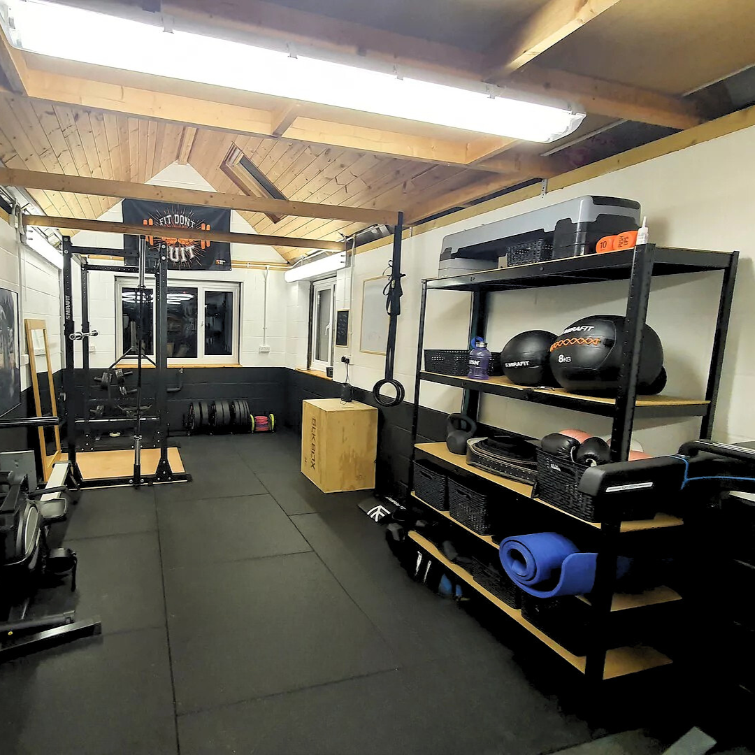 Home gym with storage shelving and plyo box on black 20mm PRO rubber gym tiles