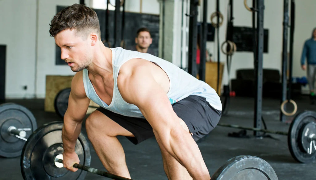 man lighting barbell 